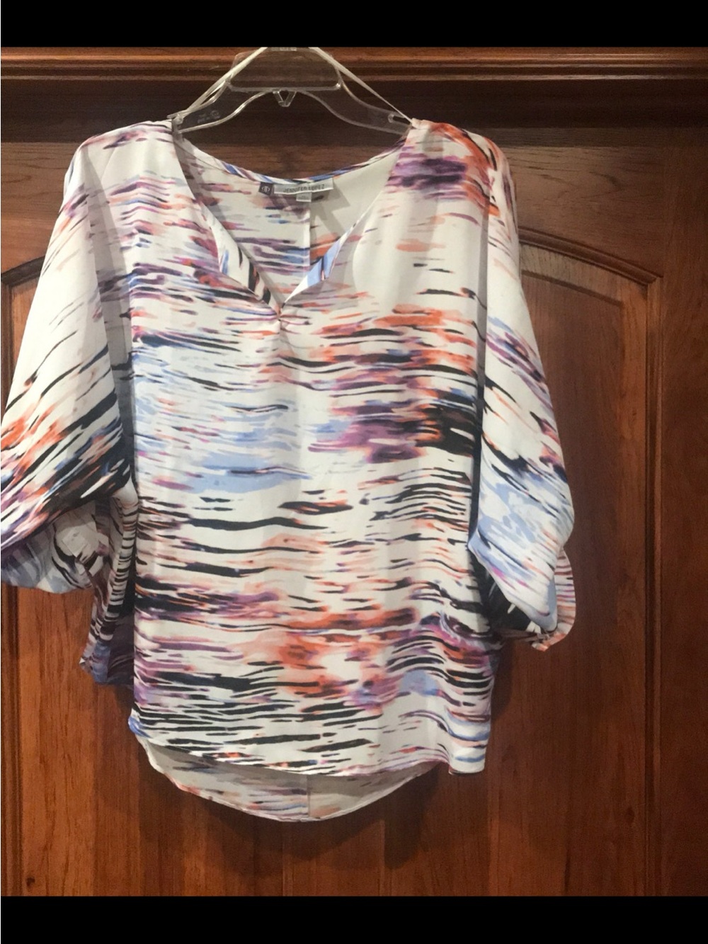 Jennifer Lopez White Blouse with Blue, Purple and Orange Abstract Print